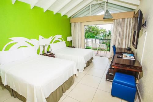 Cama ou camas em um quarto em Blue Horizon Hotel