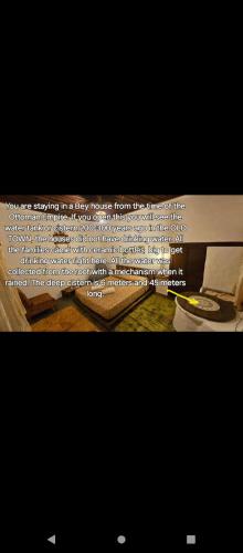 a picture of a poem on a television screen at Guest House Panorama in Berat