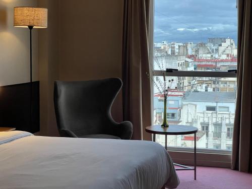 Postel nebo postele na pokoji v ubytování Uno Buenos Aires Suites