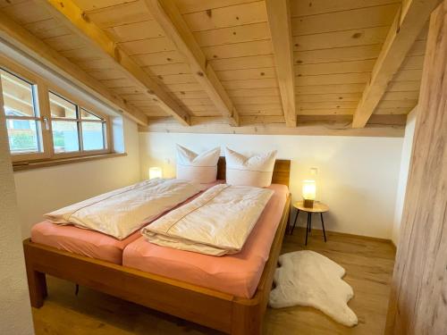 a bedroom with a large bed in a room at Ferienwohnung Kirmaier in Schwangau