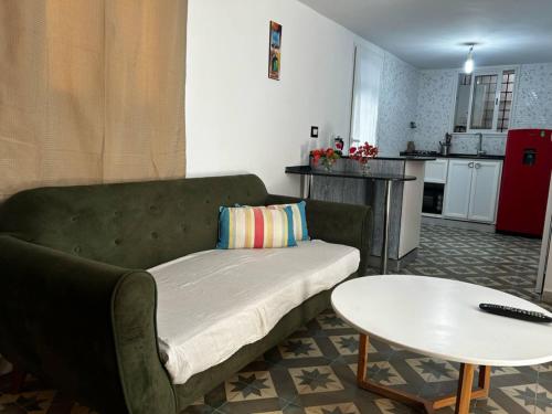 a living room with a couch and a table at Les Sables du SafSaf in La Marsa