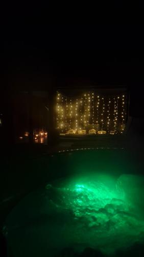 a night view of a swimming pool with lights at Domek Orłówka in Jaworzna