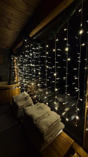 a room with lights on a wall with towels at Domek Orłówka in Jaworzna
