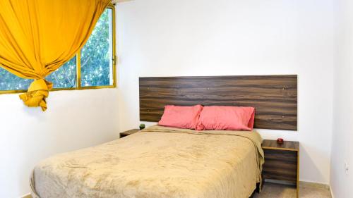 Postel nebo postele na pokoji v ubytování Casa Talento hostal hotel coliving