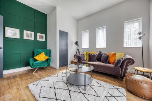 a living room with a couch and two chairs at 2 Bedroom in the Heart of Loch Lomond in Balloch
