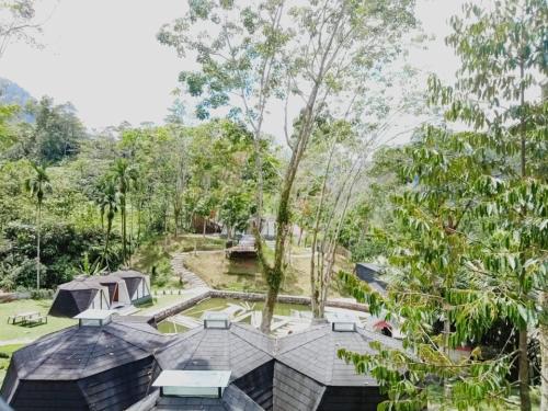 an aerial view of a house with a garden and trees at Grace Hill Villa Lubuk Minturun in Padang