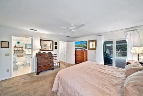 a large bedroom with a bed and a bathroom at The Turtle Nest in Sanibel