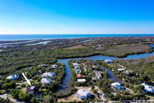an aerial view of a resort with a river at Dockside Dream at Ding Darling in Sanibel
