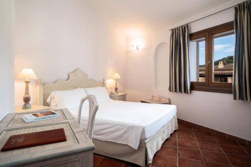 Postel nebo postele na pokoji v ubytování Hotel Monti Di Mola
