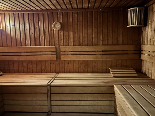 a wooden sauna with two wooden benches in it at Ferienwohnungen im Taunusblick in Lahnstein