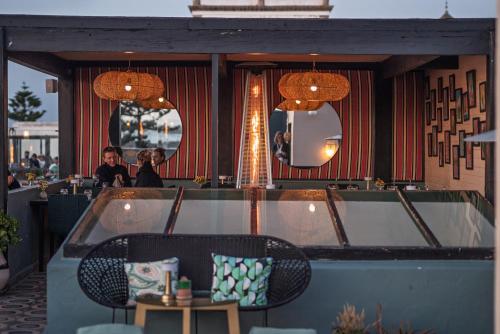 a restaurant with two people sitting at a table at Le Palazzo in Essaouira