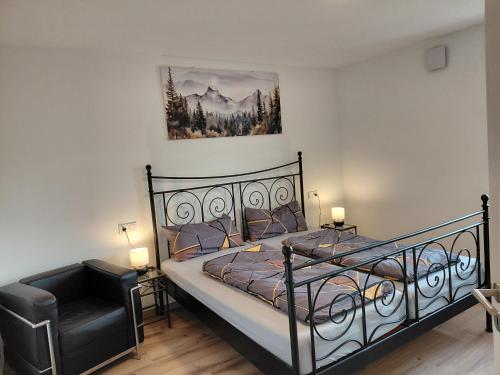 Postel nebo postele na pokoji v ubytování Ferienwohnung zum Schneiderkramer