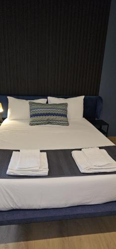Ένα ή περισσότερα κρεβάτια σε δωμάτιο στο Marinha Garden Inn - AL