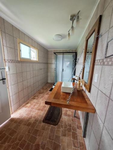 a bathroom with a sink and a mirror at Alojamiento Casa Guadalupe in San Felipe