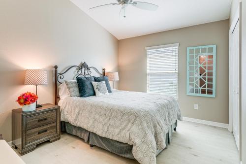 a bedroom with a bed and a ceiling fan at Village of Collier Retreat with Golf Cart and Lanai! in The Villages