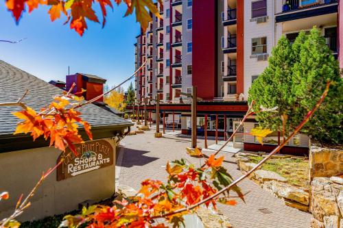 a city street with buildings and autumn leaves at Torian Plum Creekside 418 in Steamboat Springs