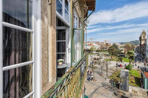 a balcony of a building with a view of a city at Sir Manuel Guest House - Unidade Centro Histórico in Braga