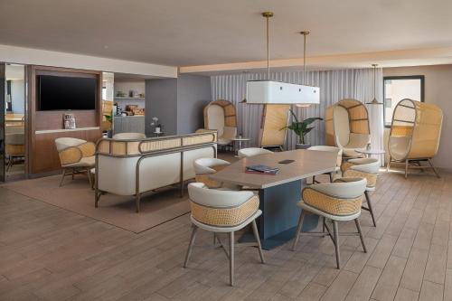 a dining room with a table and chairs at Melia Casa Maya Cancun All Inclusive in Cancún