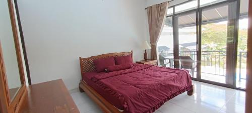 Postel nebo postele na pokoji v ubytování Villa Arti Dadi