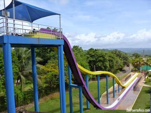 a playground with a slide in a park at Brisas de Campo in Aguadilla