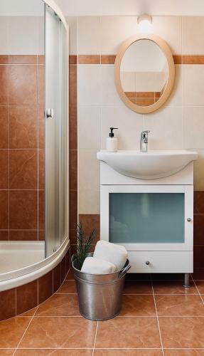 a bathroom with a sink and a mirror at Riviera in Agios Nikolaos