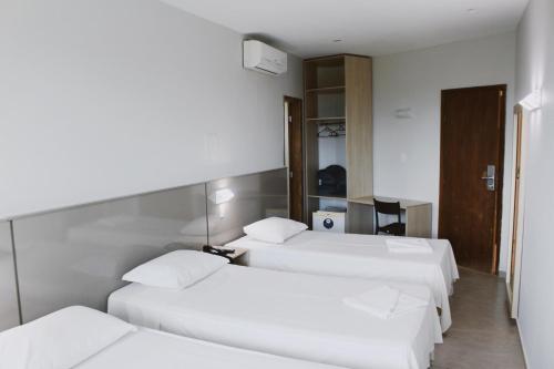 Ένα ή περισσότερα κρεβάτια σε δωμάτιο στο Hotel Canoeiros