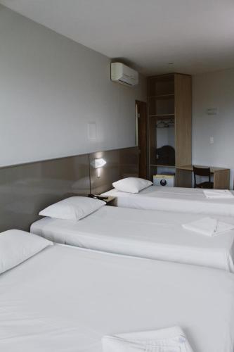 Ένα ή περισσότερα κρεβάτια σε δωμάτιο στο Hotel Canoeiros
