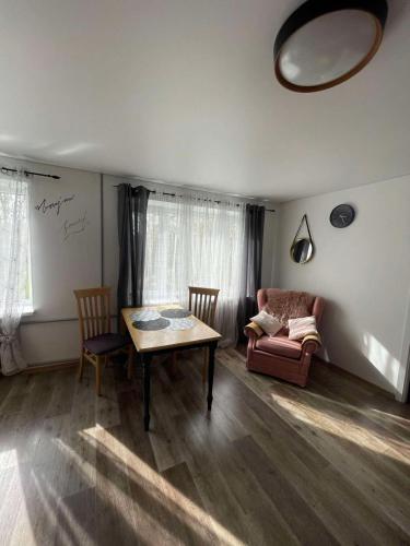 a living room with a table and a couch at VPhouseVP in Sillamäe