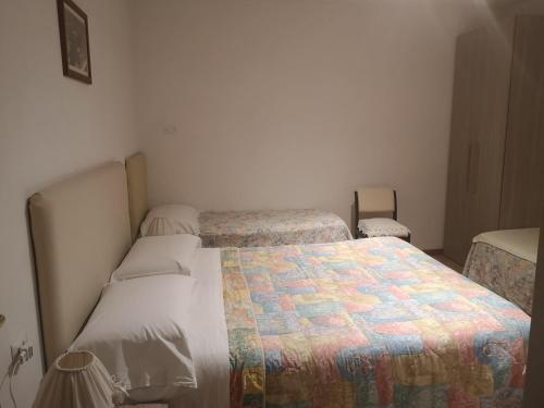 Postel nebo postele na pokoji v ubytování Il Gelsomino