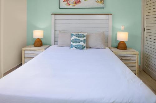 Cama o camas de una habitación en Residences by Playa Caracol Residences