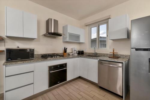 Una cocina o zona de cocina en Residences by Playa Caracol Residences