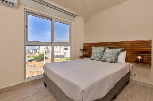 Cama o camas de una habitación en Residences by Playa Caracol Residences
