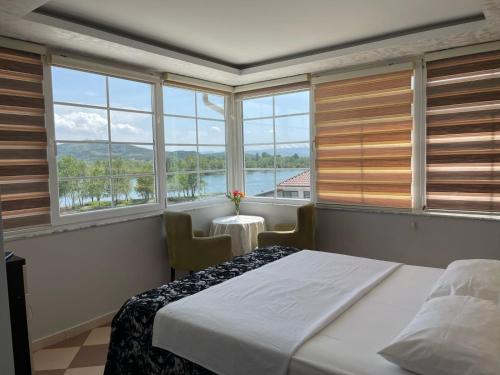 Postel nebo postele na pokoji v ubytování Hotel Fantazia