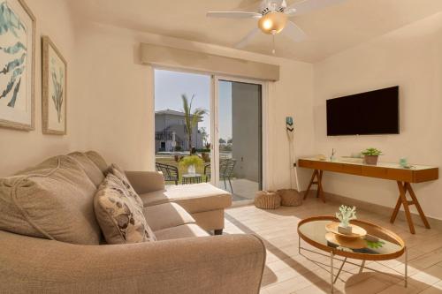 Una televisión o centro de entretenimiento en Residences by Playa Caracol Residences