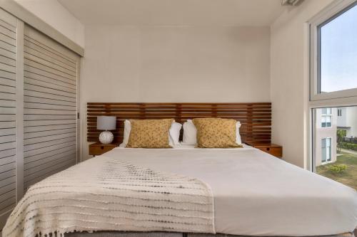 Cama o camas de una habitación en Residences by Playa Caracol Residences