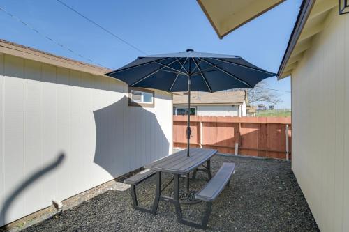 a picnic table with an umbrella and a bench at Studio 2 Mi to Feather River Bring Your Pet! in Oroville