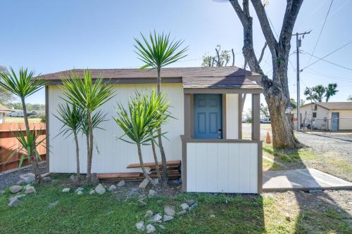 a small house with palm trees in front of it at Studio 2 Mi to Feather River Bring Your Pet! in Oroville