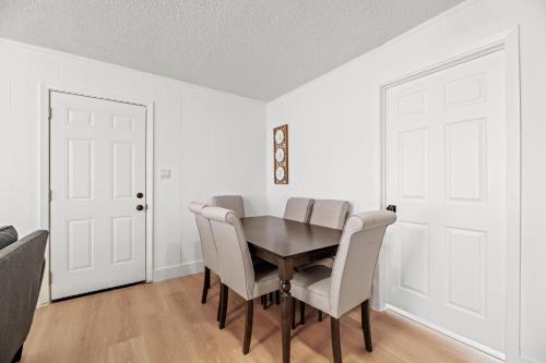 a dining room with a table and chairs at Spacious McKinney Bungalow - 4 Bedrooms in McKinney