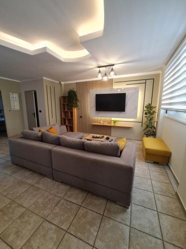 Телевизор и/или развлекательный центр в HYGGELIG apartment