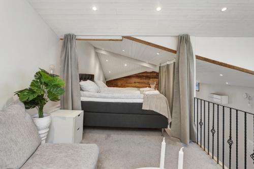 a bedroom with a bed in a room at HernöRum Storgatan - Centrala lägenheter in Härnösand