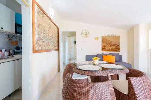 a kitchen and dining room with a table and chairs at B&B DANIELA! in Leporano Marina