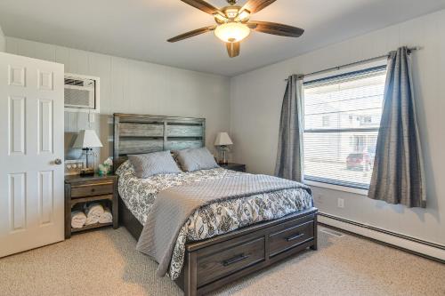 Una cama o camas en una habitación de Bayfront Home with Boat Dock and Deck in Forked River
