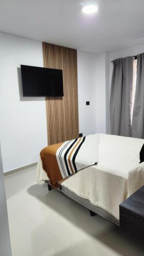 TV a/nebo společenská místnost v ubytování Caleta Design Departamento frente al mar