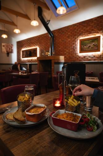 a table with two plates of food on it at Atholl Arms Hotel Dunkeld in Dunkeld