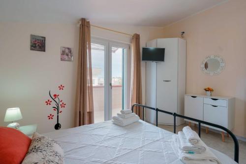 Ένα ή περισσότερα κρεβάτια σε δωμάτιο στο B&B DANIELA
