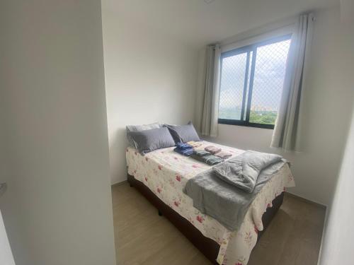 Ένα ή περισσότερα κρεβάτια σε δωμάτιο στο Apartamento 1212