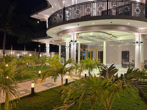 a large house with a balcony at night at Mango Mansion in Jaffna