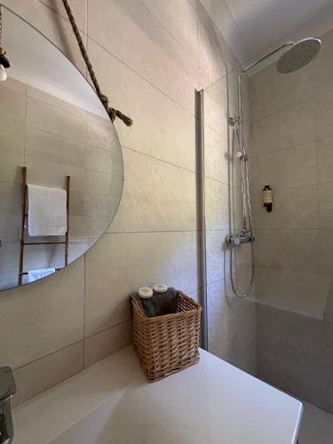 a bathroom with a shower and a mirror at Casa de Fráguas in Arouca