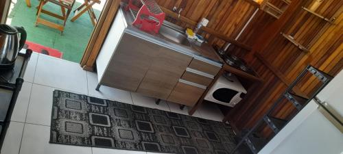an overhead view of a kitchen with a sink at Casa de praia em garopaba sc in Garopaba