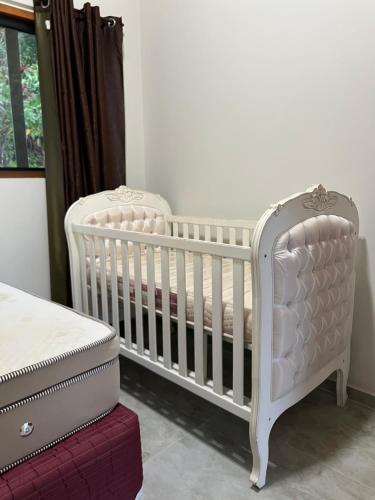 Una cama o camas en una habitación de Sossego e Boa Vista